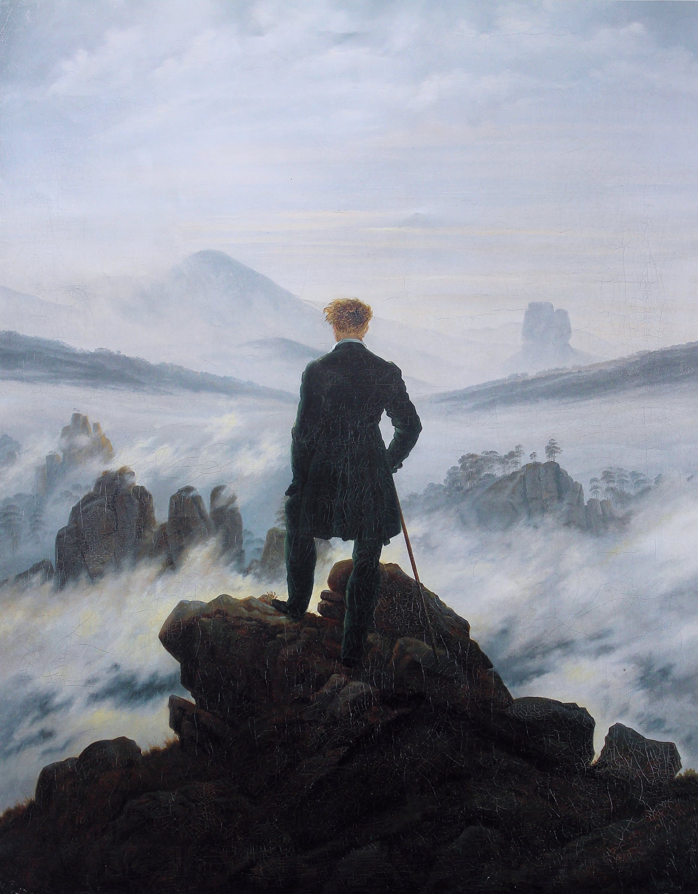 Caspar David Friedrich’s Wanderer above the Sea of Fog: a lone figure on a crag gazing across a vast fog-filled landscape.